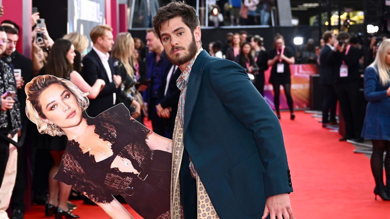 Andrew Garfield poses with a cardboard cutout of Florence Pugh at the "We Live In Time" Headline Gala during the 68th BFI London Film Festival at The Royal Festival Hall on October 17, 2024 in London, England.