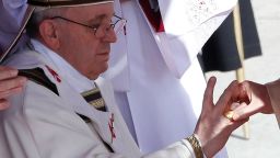 The Fisherman's Ring is placed on the finger of Pope Francis by Cardinal Angelo Sodano, Dean of the College of Cardinals during his inaugural mass at the Vatican, March 19, 2013. Pope Francis celebrates his inaugural mass on Tuesday among political and religious leaders from around the world and amid a wave of hope for a renewal of the scandal-plagued Roman Catholic Church. REUTERS/Stefano Rellandini (VATICAN - Tags: RELIGION POLITICS)