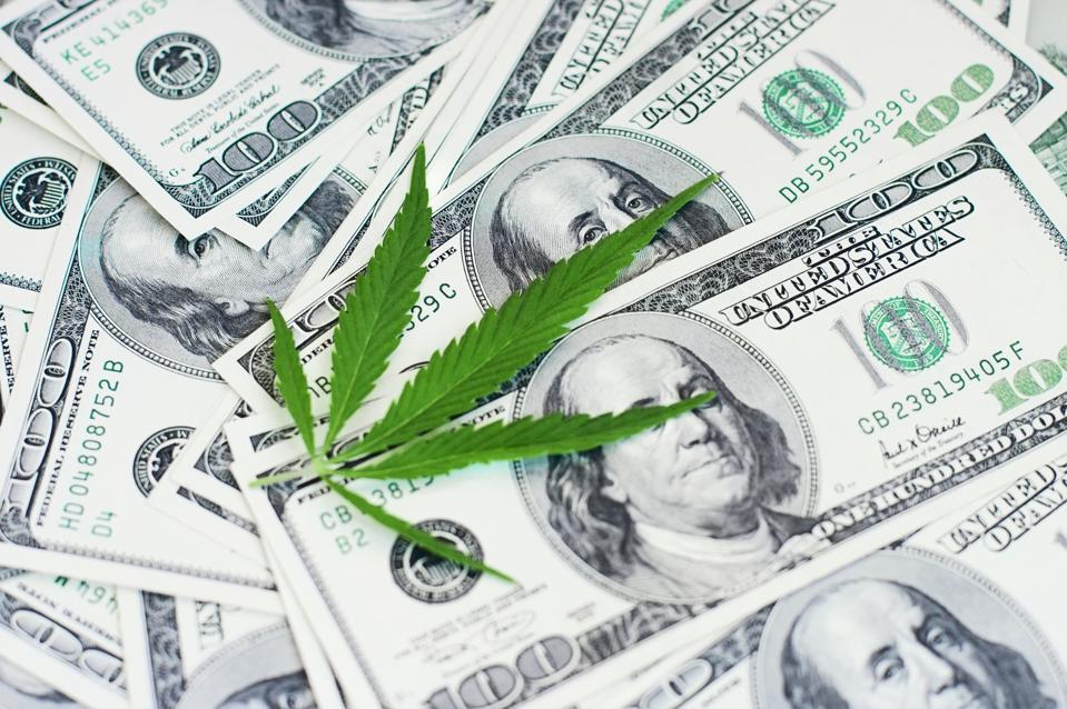 Cannabis leaf with money.